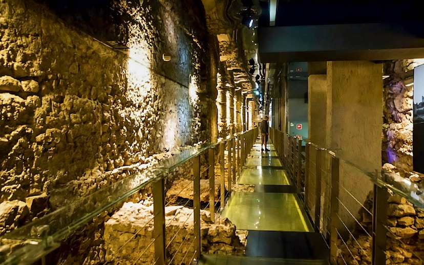 Rynek Underground passageway in Krakow with ancient stone walls.