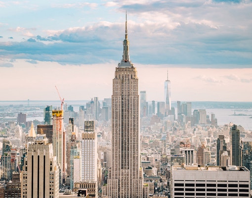 Empire State Building with New York City skyline in the background.