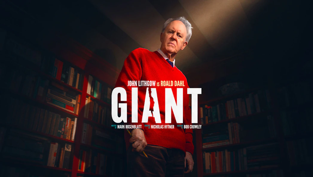 Giant Broadway show poster with actor in a library setting.