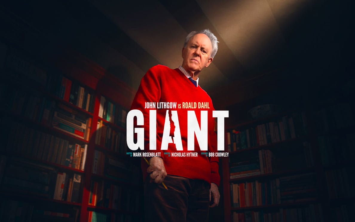 Giant Broadway show poster with actor in a library setting.