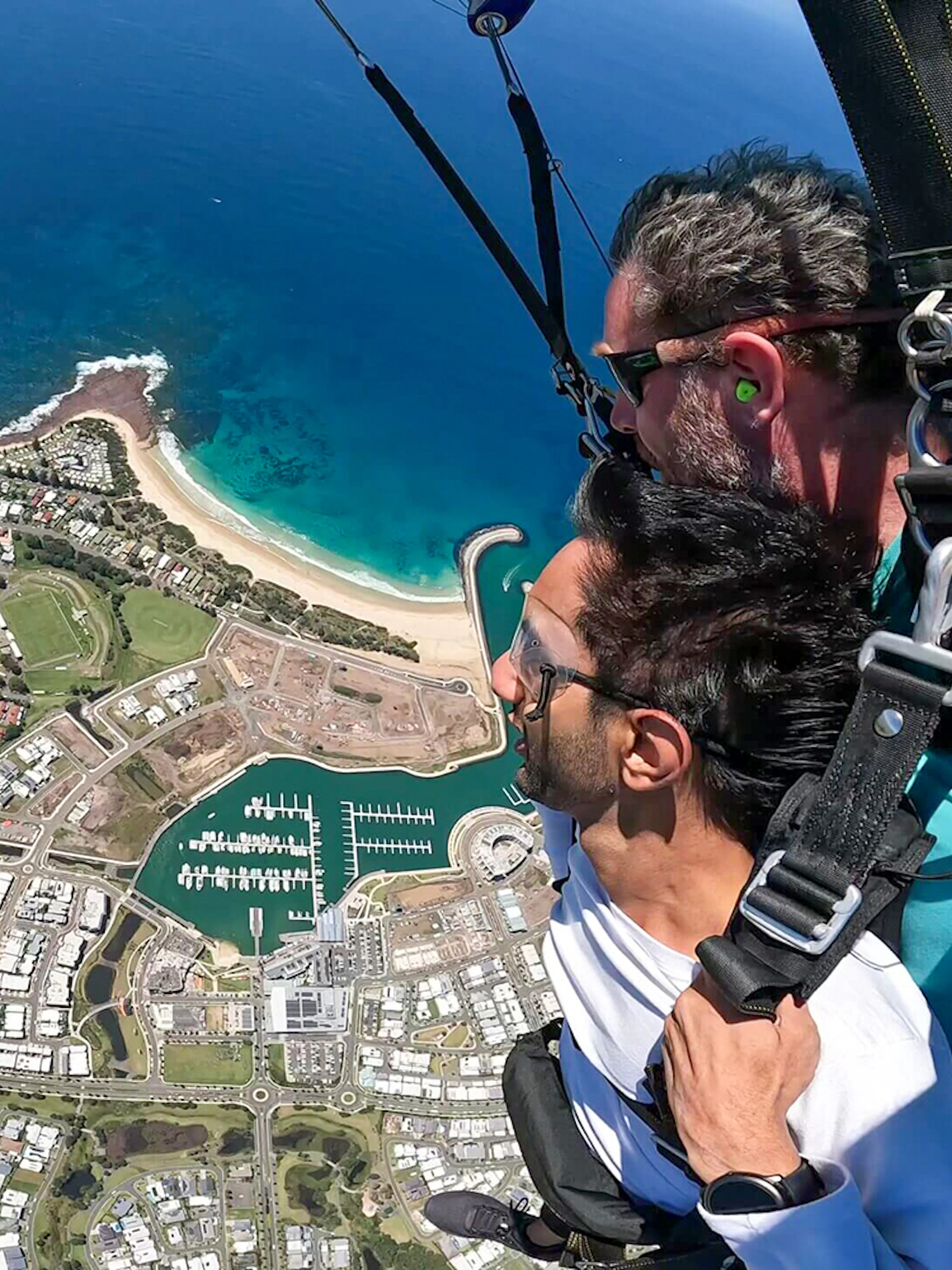 Tandem skydive over Shellharbour, Sydney, with ocean and coastline view from 15,000ft.