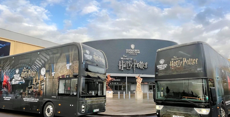 Coaches parked in front of the Harry Potter Warner Bros. Studio Tour entrance in London.
