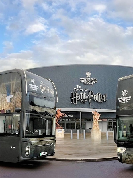 Coaches parked in front of the Harry Potter Warner Bros. Studio Tour entrance in London.