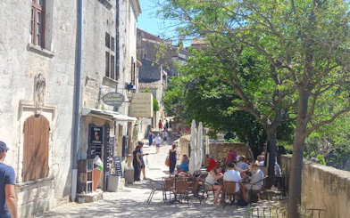 Street cafe and pedestrians in Les Baux De Provence, Provence, France.