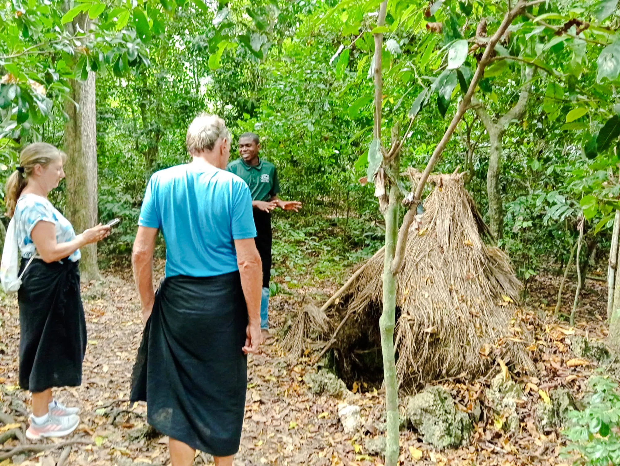 Visitors exploring Kaya Kinondo Forest with a guide, Diani Beach.