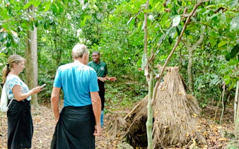 Visitors exploring Kaya Kinondo Forest with a guide, Diani Beach.