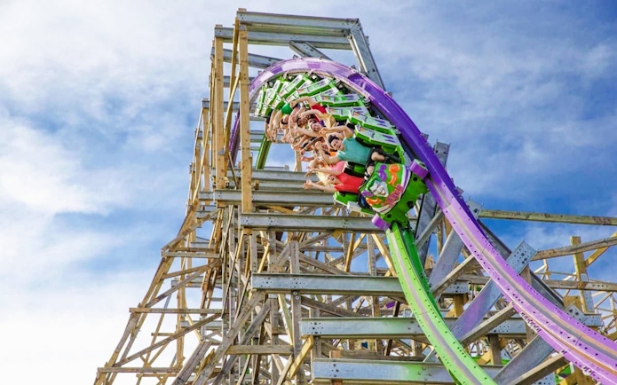 Roller coaster riders on The Joker at Six Flags Discovery Kingdom.
