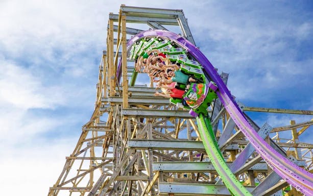 Roller coaster riders on The Joker at Six Flags Discovery Kingdom.