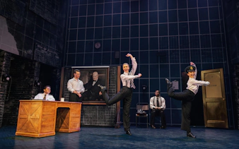 Performers dancing in a scene from Operation Mincemeat on Broadway.