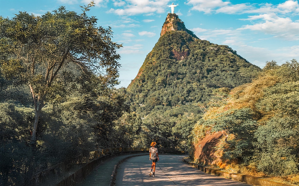 Hiker on trail towards Christ the Redeemer statue in Rio de Janeiro, Brazil.