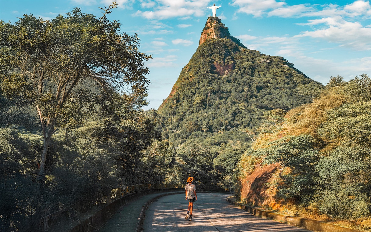 Hiker on trail towards Christ the Redeemer statue in Rio de Janeiro, Brazil.