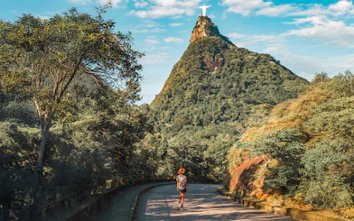 Hiker on trail towards Christ the Redeemer statue in Rio de Janeiro, Brazil.