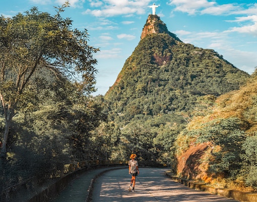 Hiker on trail towards Christ the Redeemer statue in Rio de Janeiro, Brazil.