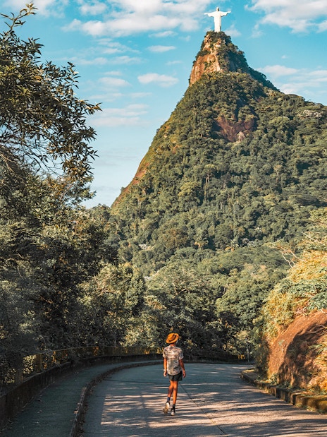 Hiker on trail towards Christ the Redeemer statue in Rio de Janeiro, Brazil.