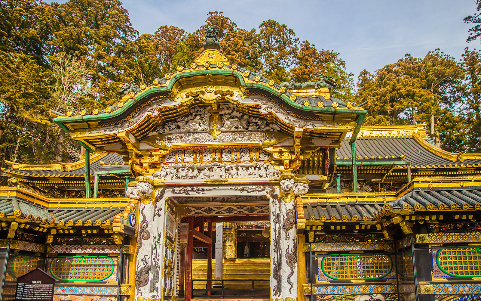 Toshogu Shrine ornate gate with intricate carvings and gold accents in Nikko, Japan.