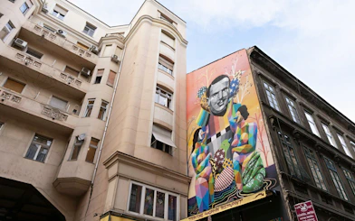 Colorful mural on a building in Budapest's Jewish Quarter during the Ghetto Wall Memorial tour.