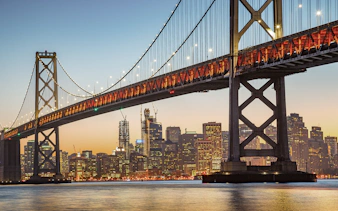 Bay Bridge at sunset with San Francisco skyline, Big Bus 1-Hr Sunset Tour.