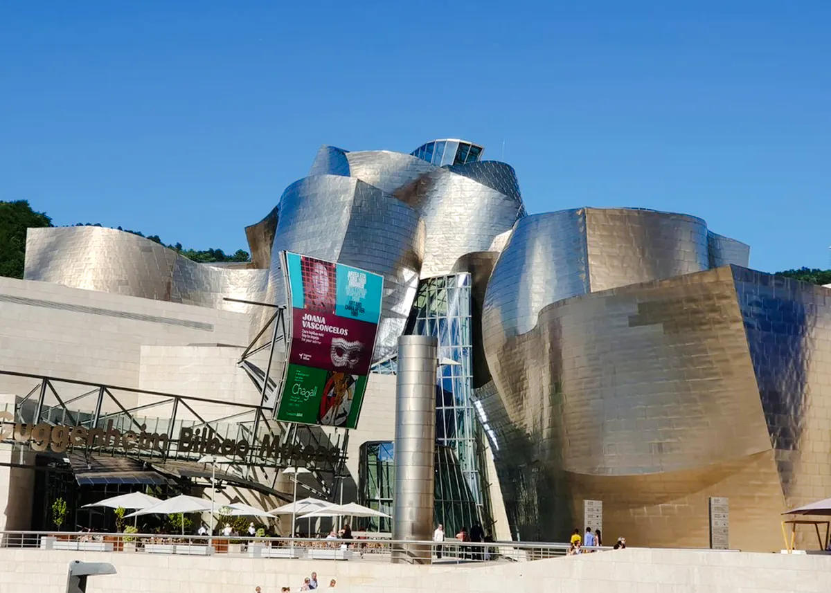 Guggenheim Museum Bilbao exterior with metallic architecture, part of San Sebastian tour.