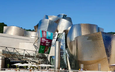 Guggenheim Museum Bilbao exterior with metallic architecture, part of San Sebastian tour.