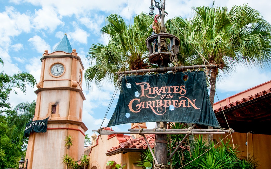 Pirates of the Caribbean entrance sign with clock tower at Walt Disney World Resort, Orlando.