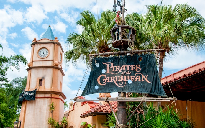 Pirates of the Caribbean entrance sign with clock tower at Walt Disney World Resort, Orlando.