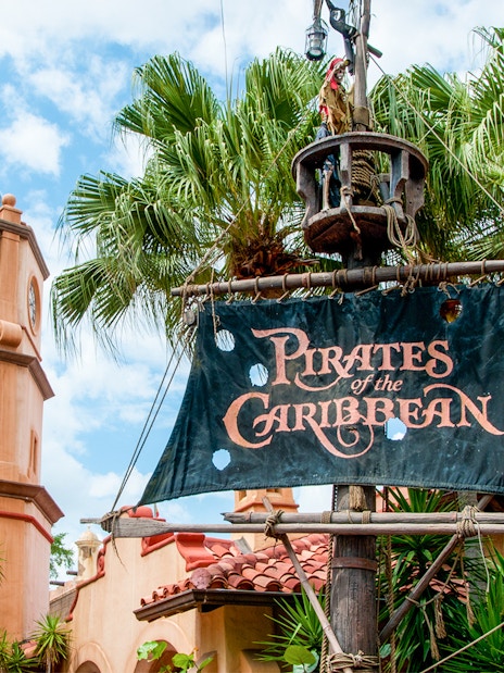 Pirates of the Caribbean entrance sign with clock tower at Walt Disney World Resort, Orlando.