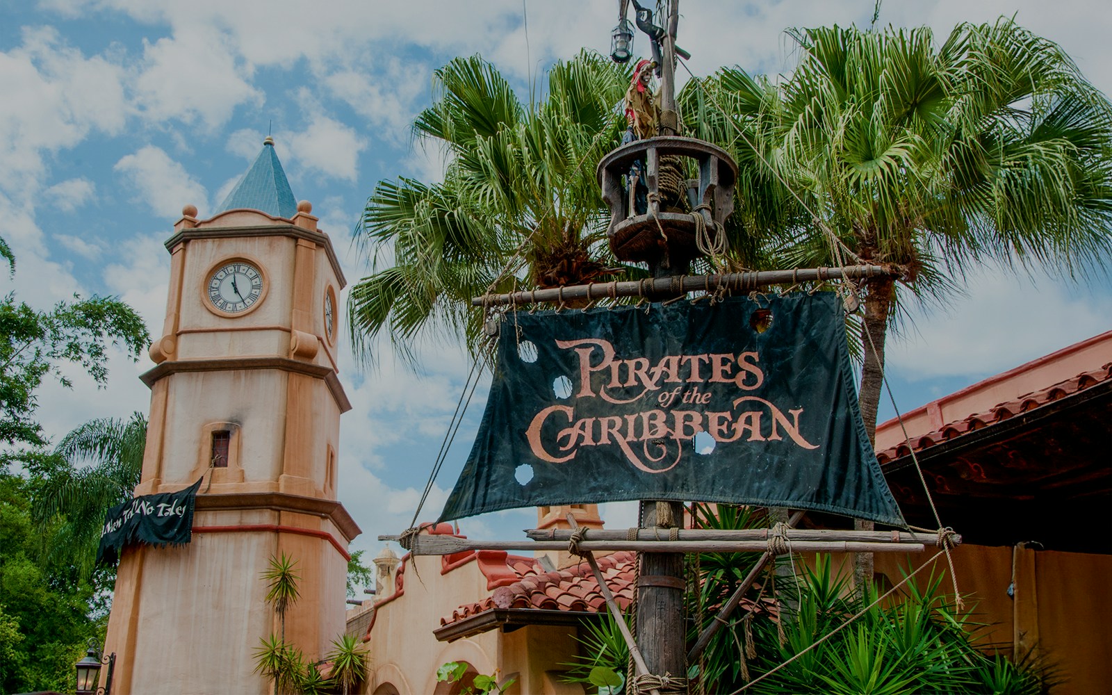 Pirates of the Caribbean entrance sign with clock tower at Walt Disney World Resort, Orlando.