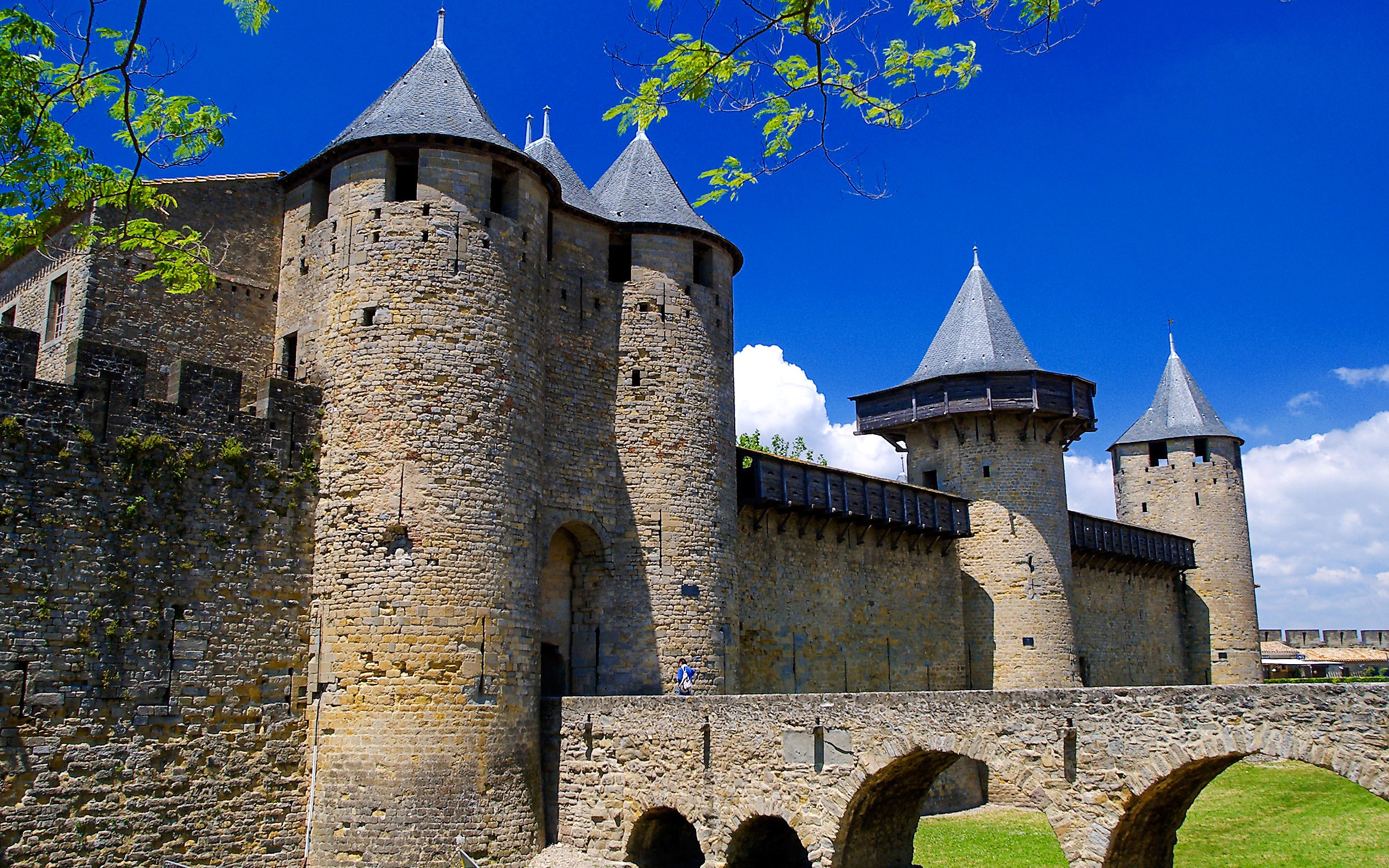 Carcassonne Castle stone towers and walls under a clear blue sky.