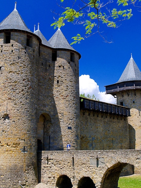 Carcassonne Castle stone towers and walls under a clear blue sky.