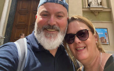 Selfie of two people in front of a historic building in Nice during the Ghosts of the Riviera tour.