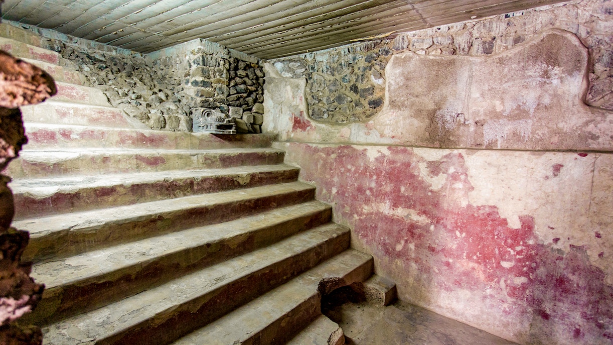 Stone steps and red murals inside the Jaguar Palace, Teotihuacan, Mexico.