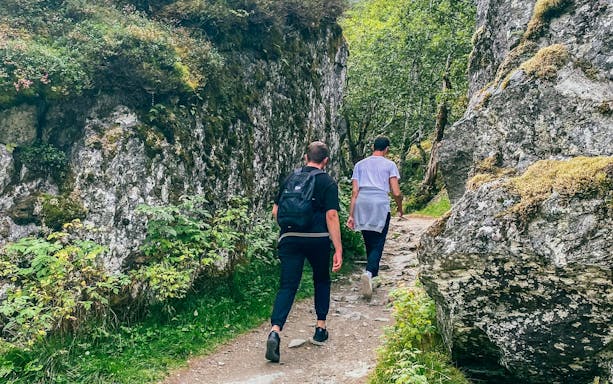 Hikers on a trail in Folgefonna National Park, Norway.