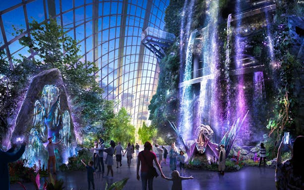 Visitors exploring the illuminated Supertree Grove at Gardens by the Bay, Singapore.