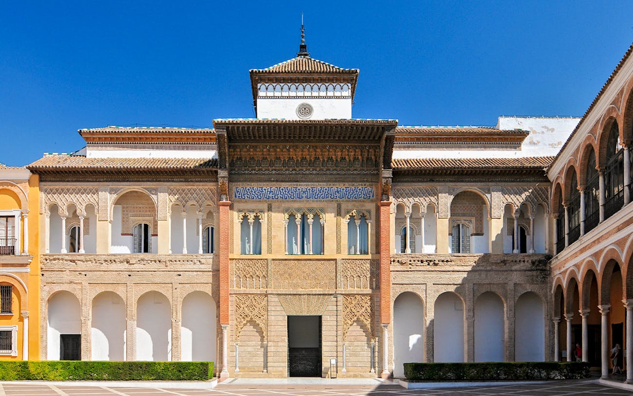 King Peter's Palace facade in Patio de la Monteria, Alcazar Palace, Seville, Spain.