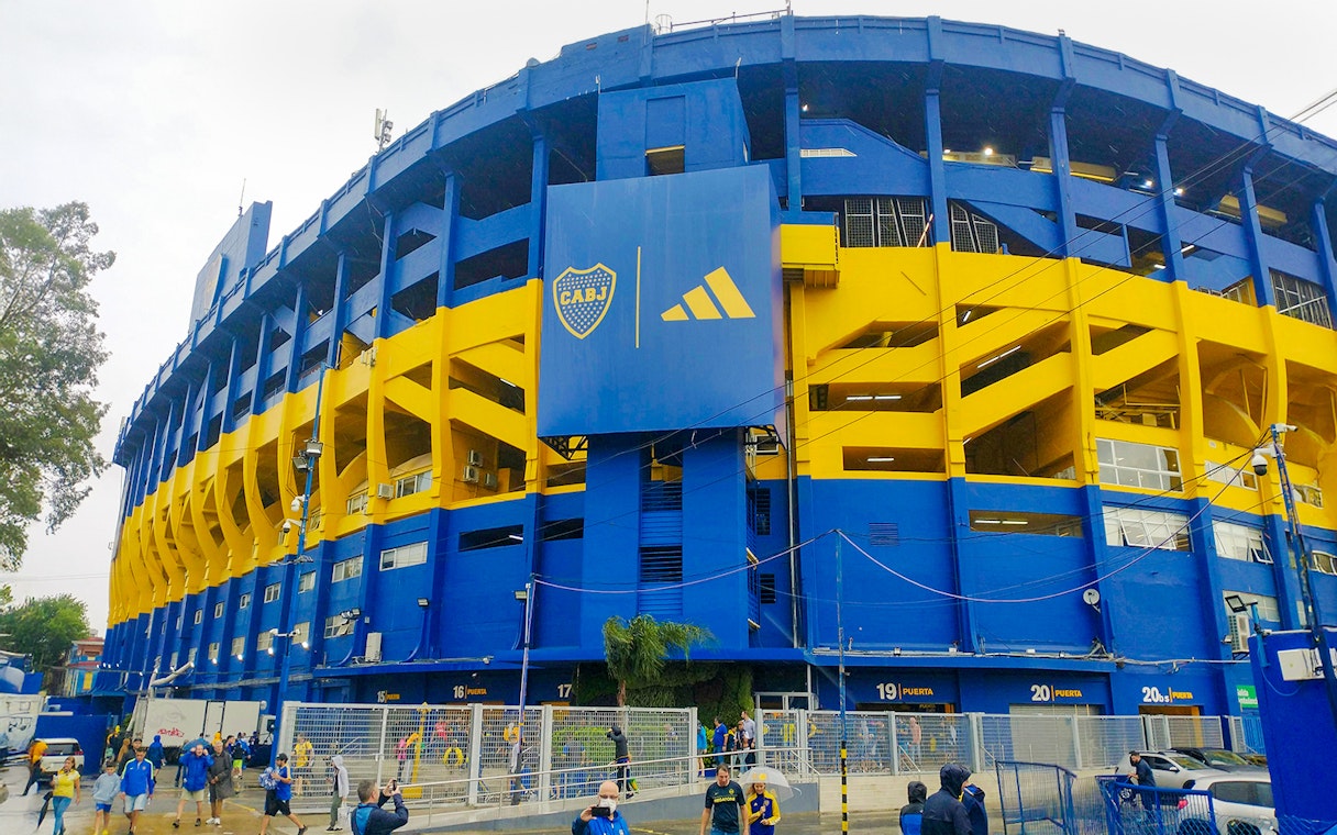 La Bombonera stadium exterior with people walking outside, Buenos Aires, Argentina.