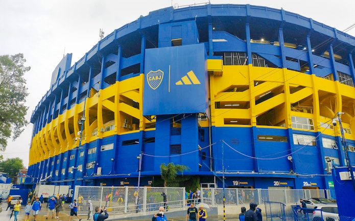 La Bombonera stadium exterior with people walking outside, Buenos Aires, Argentina.