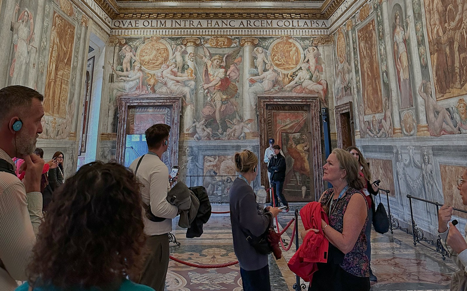 Visitors exploring frescoes inside Castel Sant'Angelo, Rome.