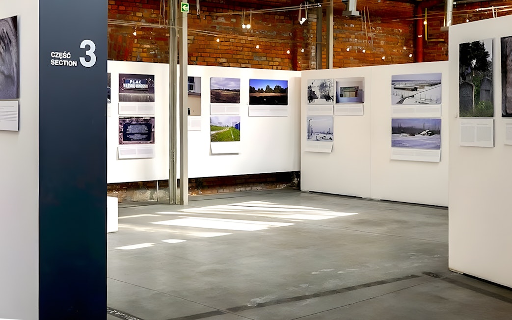 Exhibit space at Galicia Jewish Museum in Kraków displaying historical photographs.