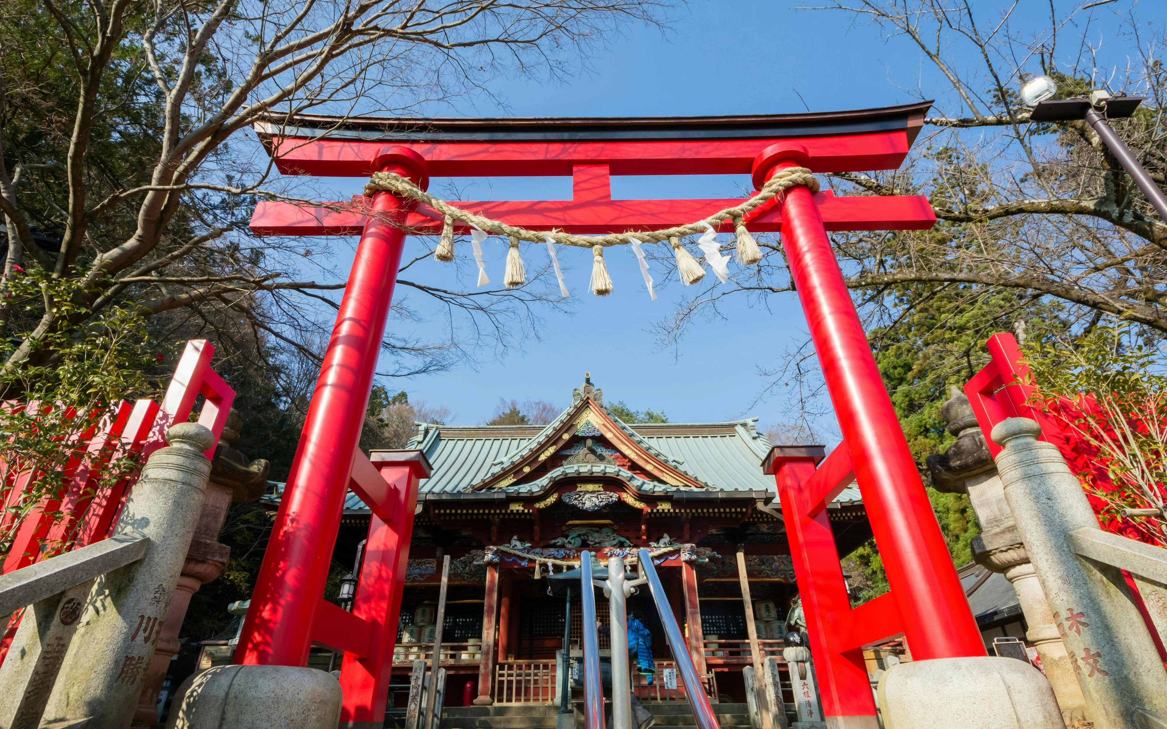Red Torii gate at Takao-san Yakuō-in Temple on Mount Takao, Tokyo, Japan.