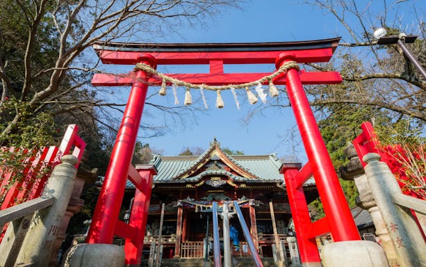 Red Torii gate at Takao-san Yakuō-in Temple on Mount Takao, Tokyo, Japan.