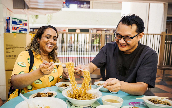 People enjoying ramen at a Michelin-rated restaurant.