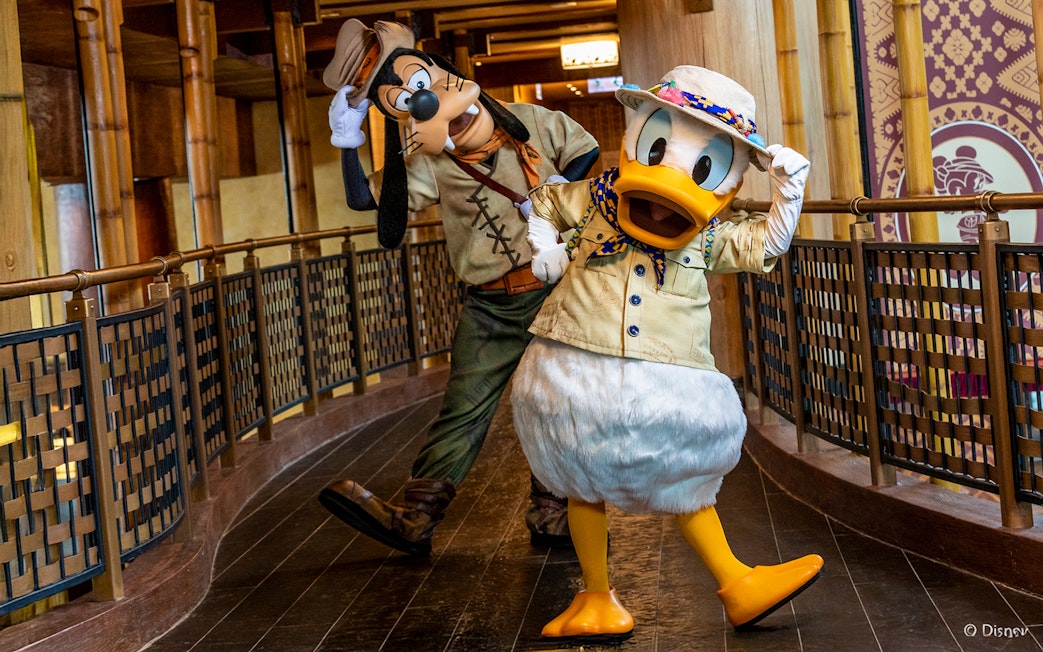 Donald Duck and Goofy in adventure outfits at Disneyland Hong Kong.