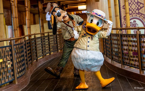 Donald Duck and Goofy in adventure outfits at Disneyland Hong Kong.