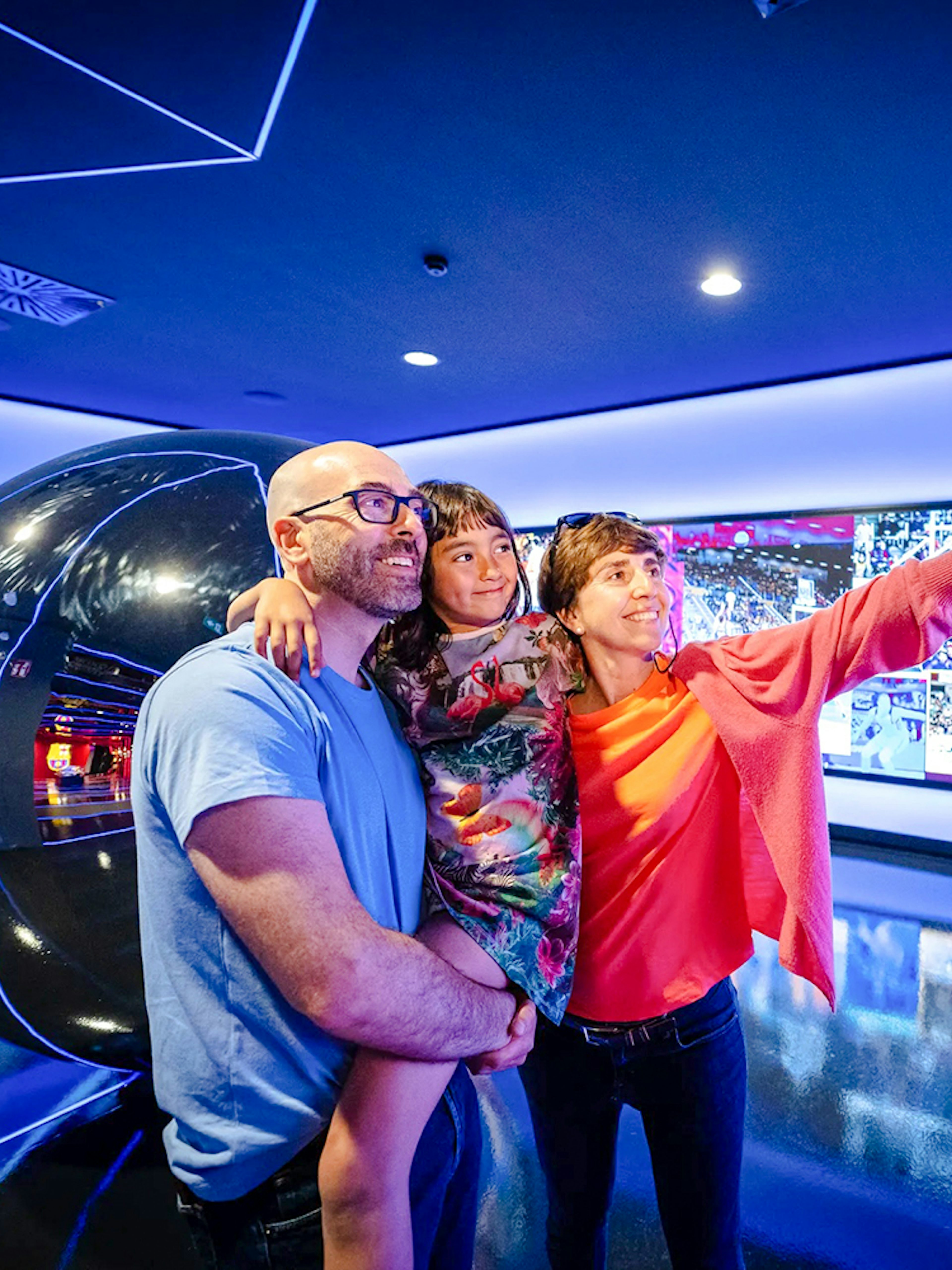Family taking a selfie at the Barça Museum in Spotify Camp Nou, Barcelona.