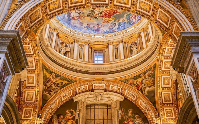 Paintings on the dome of St. Peter's Basilica, Vatican City, depicting religious scenes.
