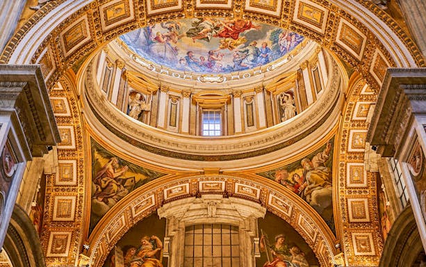 Paintings on the dome of St. Peter's Basilica, Vatican City, depicting religious scenes.