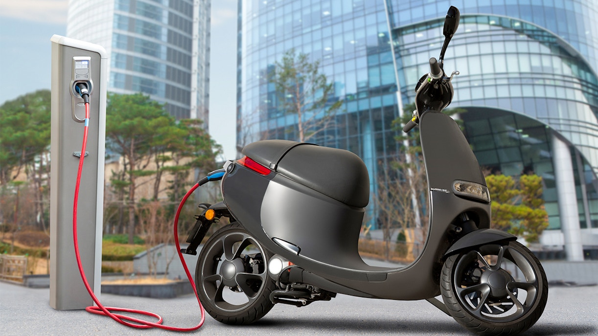 Electric scooters lined up in Barcelona, available with the Barcelona Travel Card.