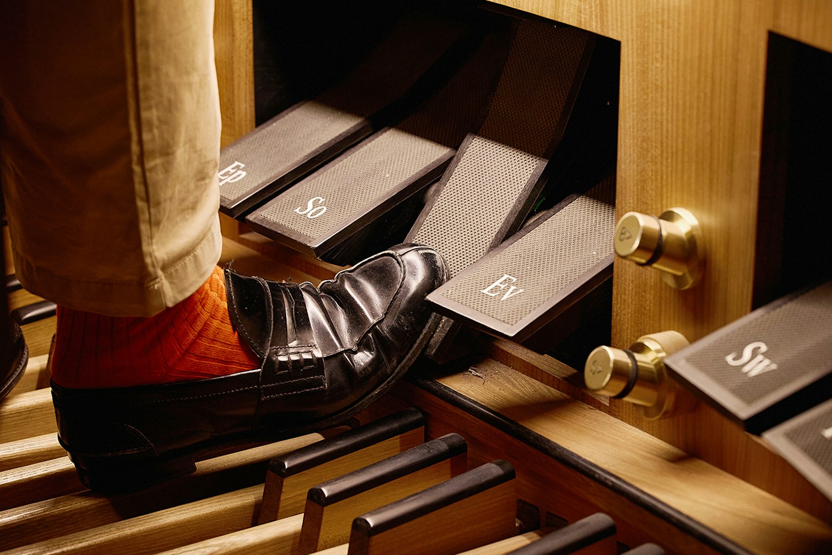 Organist's foot on pedal at St. Stephen's Cathedral concert.