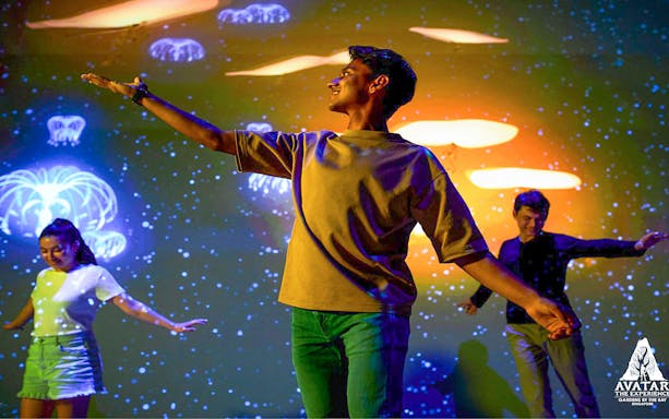 Visitors enjoying interactive light display at Gardens by the Bay's Avatar: The Experience, Cloud Forest.