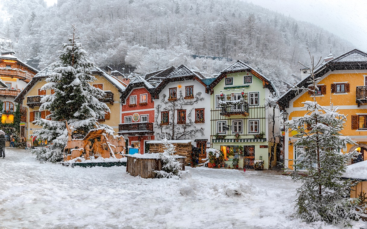 Old town buildings covered in snow during winter, Hallstatt.